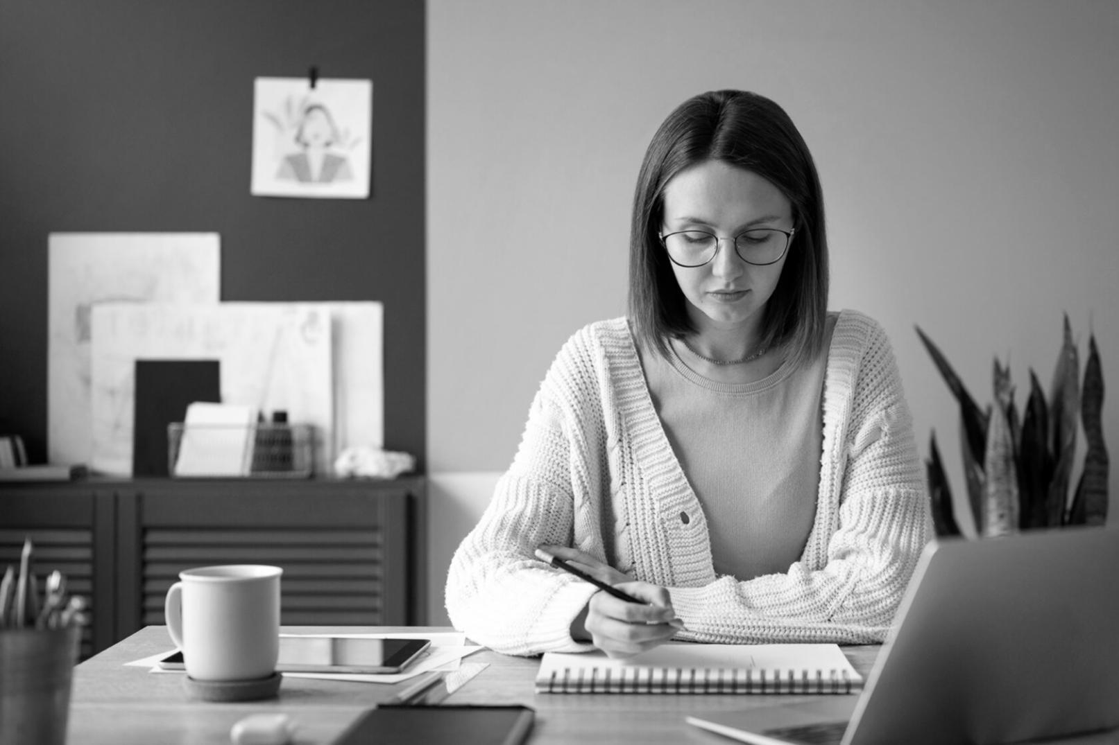 Business team reviewing CRM dashboard on laptop